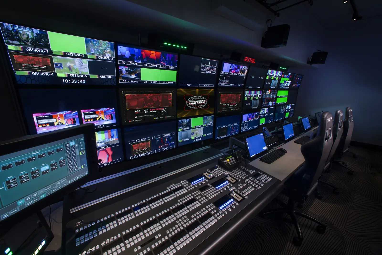 Production control room with switcher panel and monitor wall